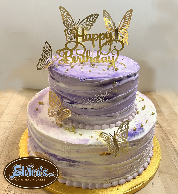 Two-tier lavender buttercream birthday cake with gold butterflies